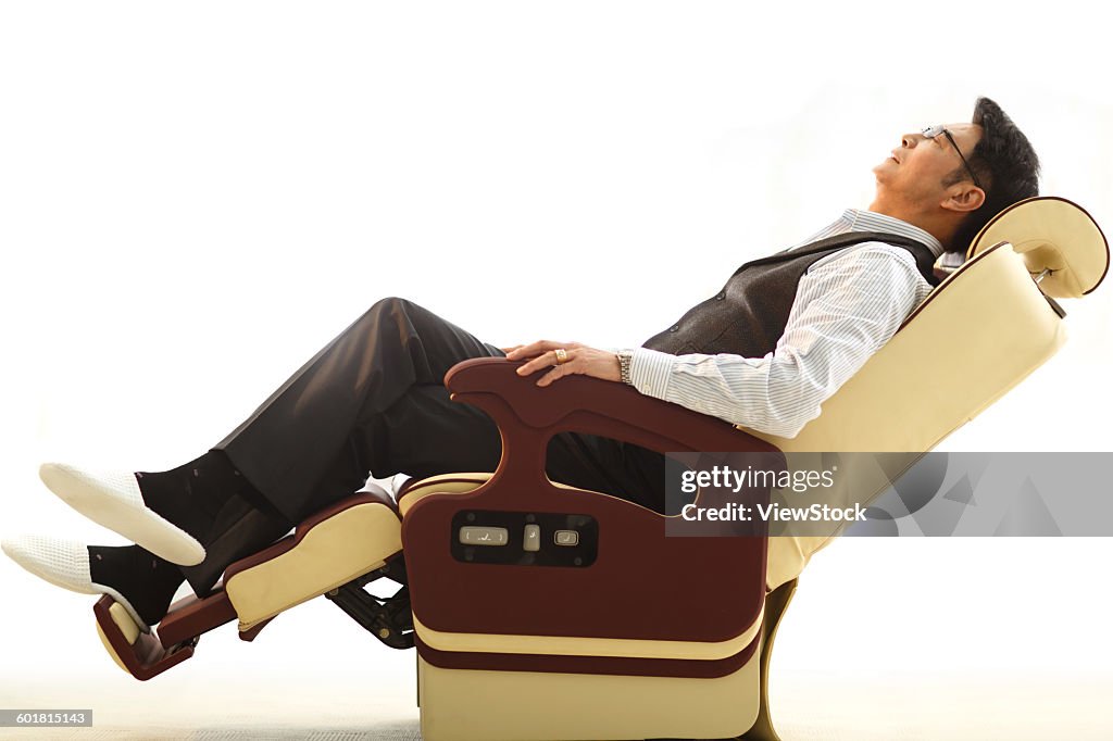 Business people lean on the chair