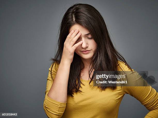 unhappy brunette young woman - miscarriage stock pictures, royalty-free photos & images