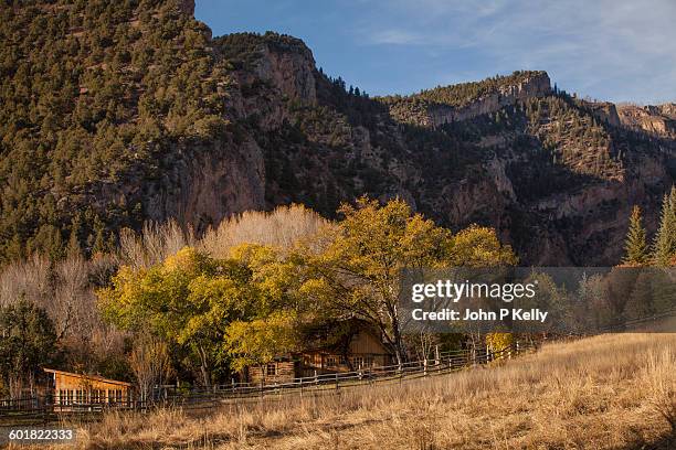 western ranch house surrounded by mountains - ranch house stock pictures, royalty-free photos & images