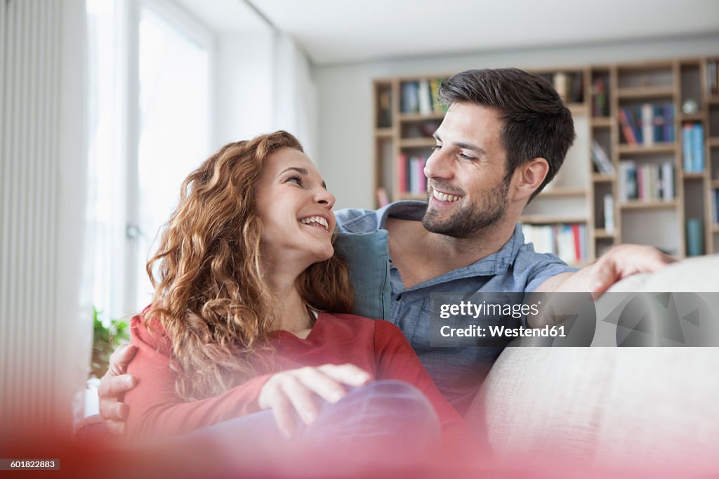 Relaxed couple at home on couch