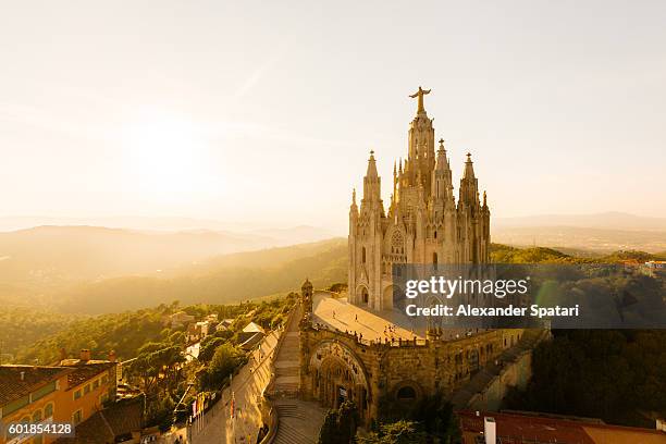 view of the temple of the sacred heart of jesus at tibidabo mountain, barcelona, catalonia, spain - tibidabo fotografías e imágenes de stock