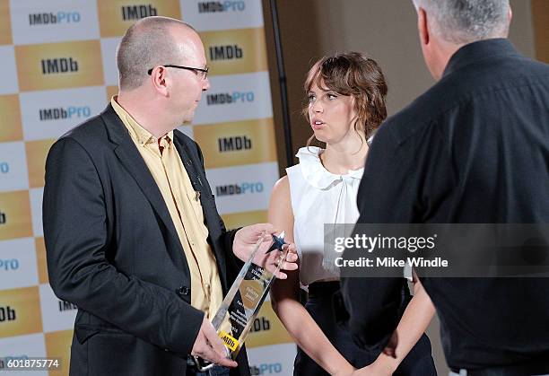 IMDb Founder & CEO Col Needham presents Felicity Jones with the IMDb Fan Favorite STARmeter Award at the 2016 Toronto International Film Festival on...