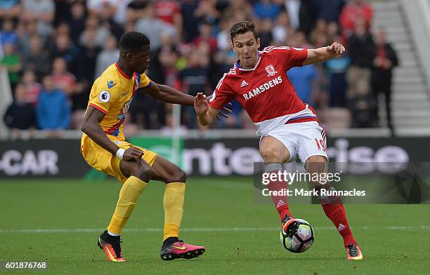 Stewart Downing of Middlesbrough and Wilfried Zaha of Crystal Palace battle for possession during the Premier League match between Middlesbrough and...