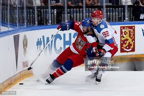 Michal Jordan of Czech Republic and Evgeny Kuznetsov of Russia battle for the puck during the 2016 World Cup of Hockey preparation match between...