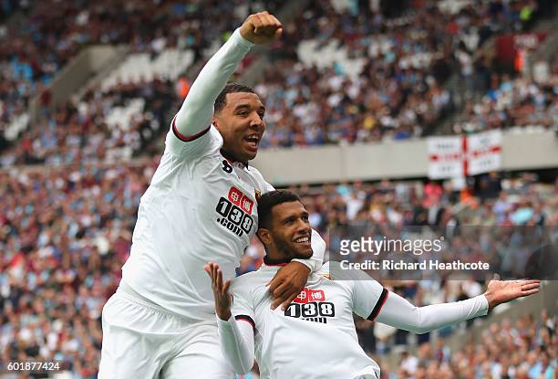 Etienne Capoue of Watford and Troy Deeney of Watford during the Premier League match between West Ham United and Watford at Olympic Stadium on...