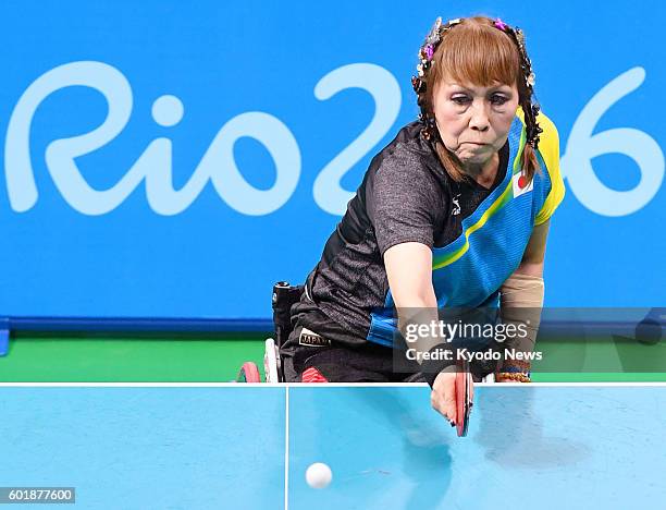 Kimie Bessho, a 68-year-old Japanese table tennis player in a wheelchair, competes against Pui Yi Wong of Hong Kong in the women's singles...