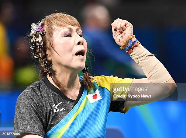 Kimie Bessho, a 68-year-old Japanese table tennis player in a wheelchair, celebrates after winning a point against Pui Yi Wong of Hong Kong in the...