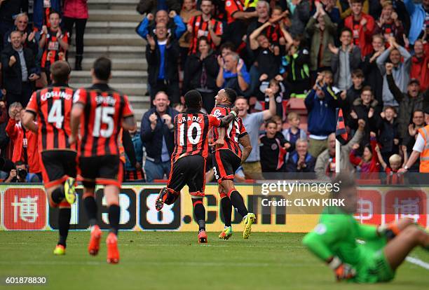 Bournemouth's English striker Callum Wilson celebrates scoring his team's first goal during the English Premier League football match between...