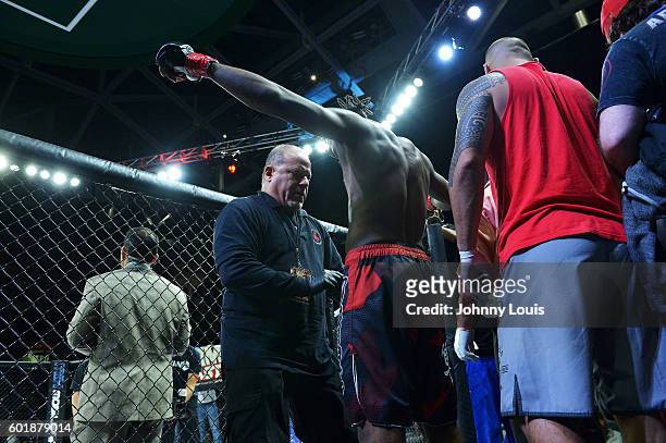 Martin Brown enter The Octogon to fight Brok Weaver in their 160 Catchweight bout during the TITAN FC41 UFC fight event at Bank United Center on...