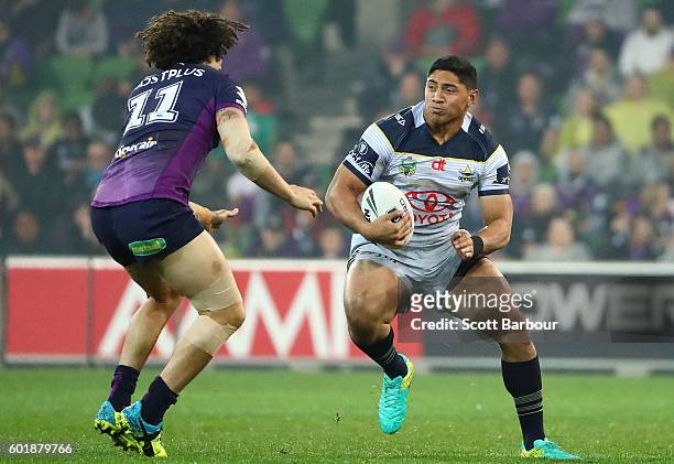 Jason Taumalolo of the Cowboys is tackled during the NRL Qualifying Final match between the Melbourne Storm and the North Queensland Cowboys at AAMI...