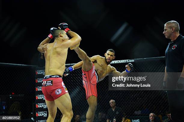 Raush Manfio fight Demarques Jackson in their Lightweight bout during the TITAN FC41 UFC fight event at Bank United Center on September 9, 2016 in...