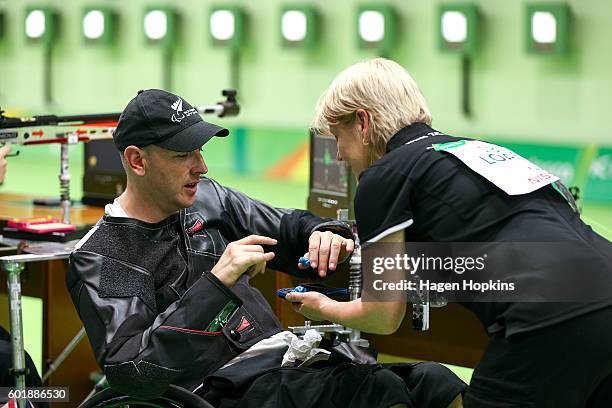 Michael Johnson of New Zealand takes his earpieces out after competing in the R4 Mixed 10m Air Rifle Standing SH2 qualification round on day 3 of the...