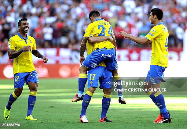 Las Palmas' midfielder Tana Dominguez celebrates a goal with teammates during the Spanish league football match Sevilla FC vs UD Las Palmas at the...