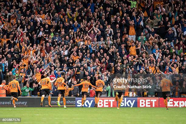 Wolverhampton Wanderers players and fans celebrate after Prince Oniangue scored the opening goal during the Sky Bet Championship match between...