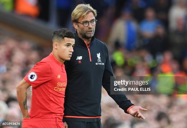 Liverpool's German manager Jurgen Klopp speaks to Liverpool's Brazilian midfielder Philippe Coutinho on the touchline during the English Premier...