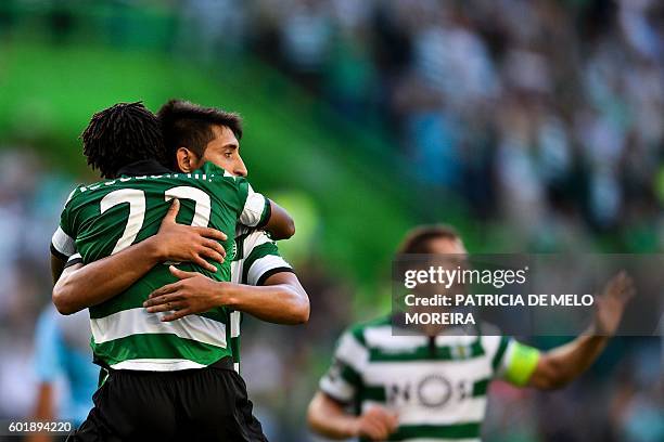 Sporting's forward Gelson Martins celebrates a goal with teammate Argentinian midfielder Alan Ruiz during the Portuguese league football match...