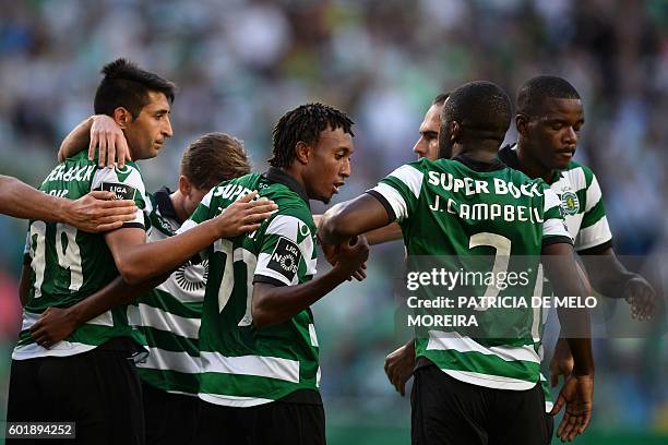 Sporting's forward Gelson Martins celebrates a goal with teammates during the Portuguese league football match Sporting CP vs Moreirense FC at the...