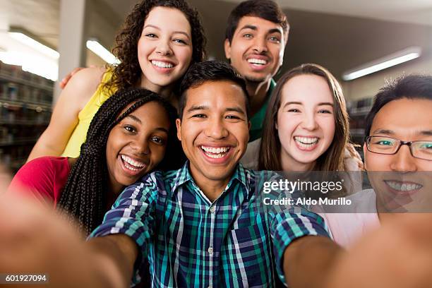 multi-ethnic group of college students taking a selfie - korean mexican woman stock pictures, royalty-free photos & images