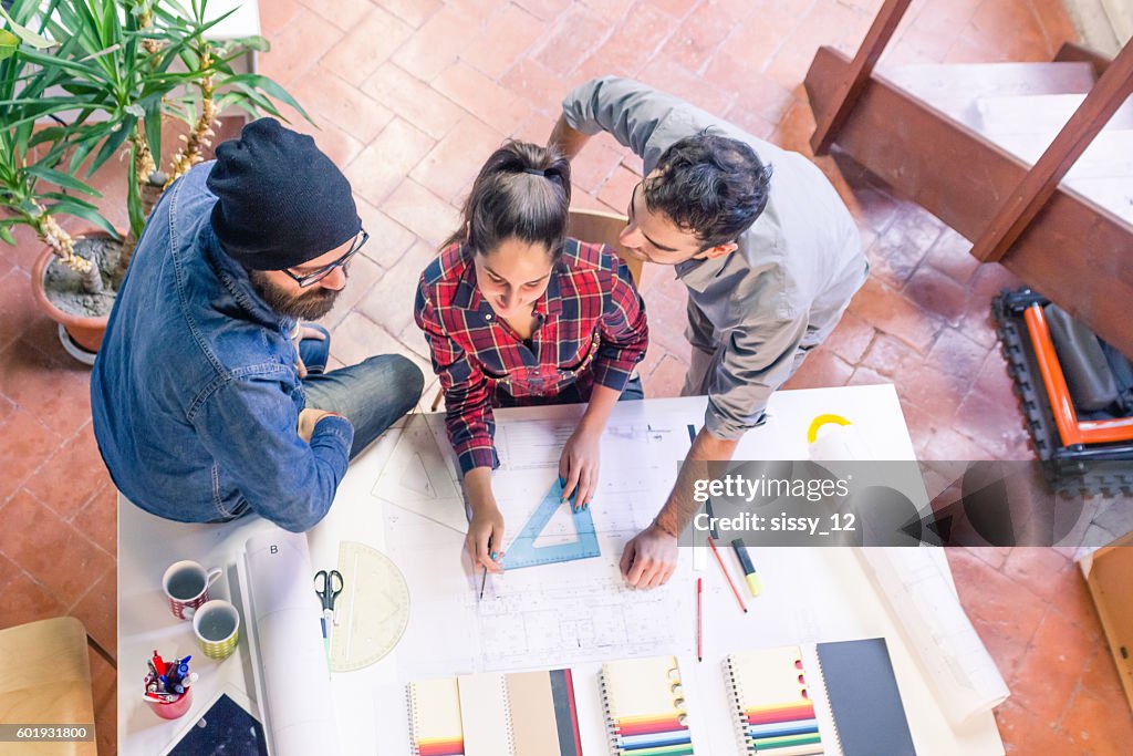 Overhead view of architects brainstorming