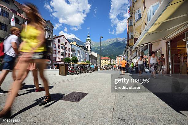 innsbruck main shopping street, motion blur - innsbruck stock pictures, royalty-free photos & images