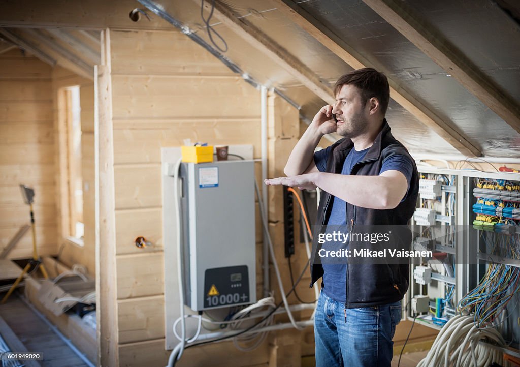 Handyman constructing his own home
