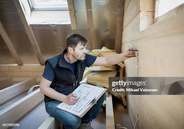 handyman constructing his own home - electric piano foto e immagini stock