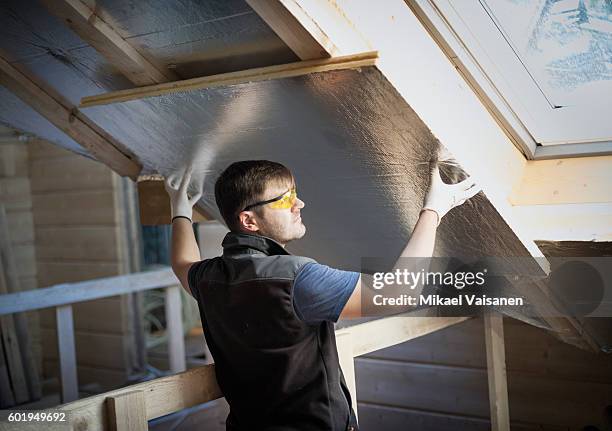 handyman working on his own house - craftsperson stock pictures, royalty-free photos & images