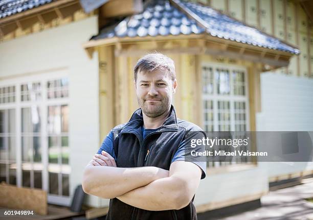 handyman working on his own house - handyman smiling imagens e fotografias de stock