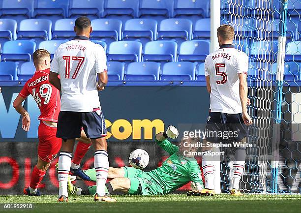 Milton Keynes Dons Ryan Colclough scores his sides first goal beating Bolton Wanderers Mark Howard during the Sky Bet League One match between Bolton...