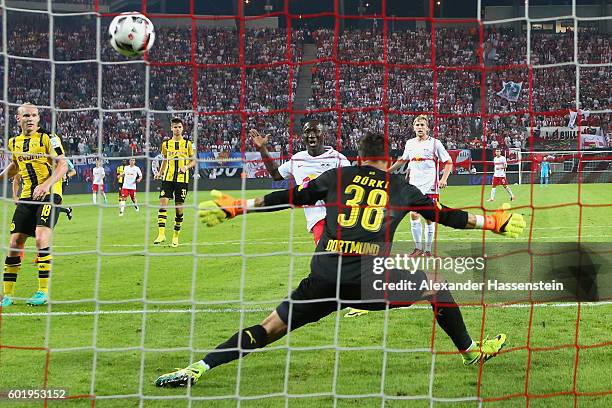 Naby Deco Keita of Leipzig scores the first goal against Roman Buerki, keeper of Dortmund during the Bundesliga match between RB Leipzig and Borussia...
