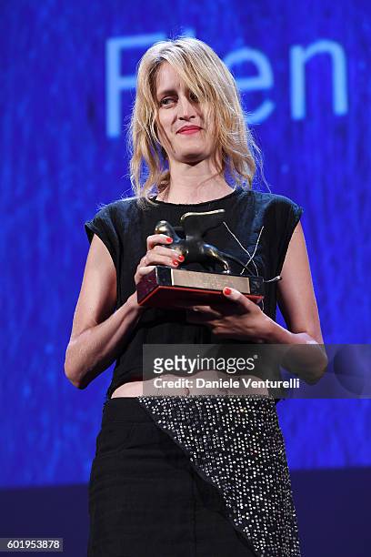 Director Fien Troch poses with the Orizzonti Award for Best Director for 'Home' during the closing ceremony of the 73rd Venice Film Festival at Sala...