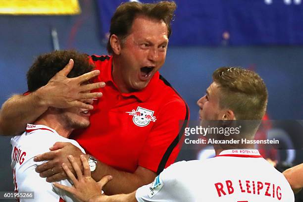 Ralph Hasenhuettl, head coach of Leipzig celebrates the first team goal with his players during the Bundesliga match between RB Leipzig and Borussia...