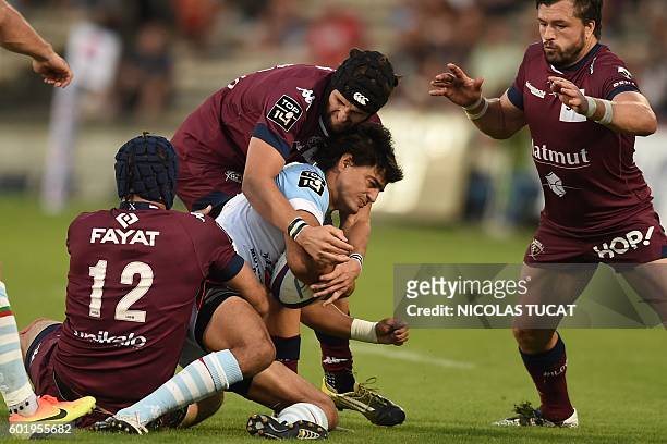 Bayonne's Argentinian fullback Martin Bustos Moyano is tackled during the French Top 14 rugby union match between Bordeaux-Bergles and Bayonne on...