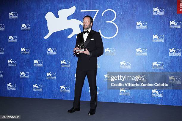 Director Tom Ford poses with the Silver Lion for Grand Jury Prize for 'Nocturnal Animals' during the award winners photocall during the 73rd Venice...