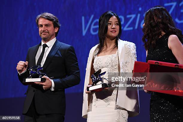 Zhao Wei wears a Jaeger-LeCoultre watch on stage next to Lorenzo Vigas during the 'Closing Ceremony' of the 73rd Venice Film Festival at Hotel...