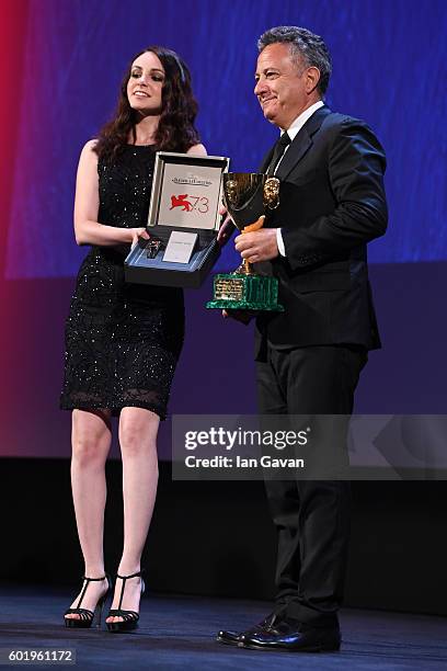 Jaeger-LeCoultre Unique Reverso watch is held to go along with as Paolo Del Brocco accepts the Coppa Volpi for Best Actress for Emma Stone for 'La La...