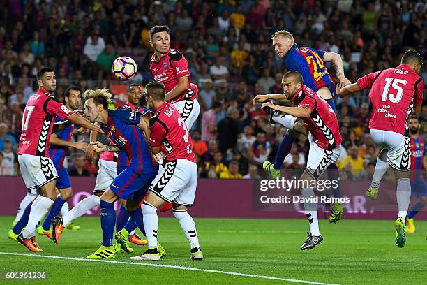 Jeremy Mathieu of FC Barcelona scores his team's first goal during the La Liga match between FC Barcelona and Deportivo Alaves at Camp Nou stadium on...