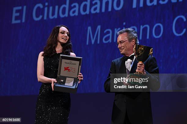 Actor Oscar Martinez is given a Jaeger-LeCoultre Unique Reverso engraved watch as he receives the Coppa Volpi for Best Actor for 'The Distinguished...
