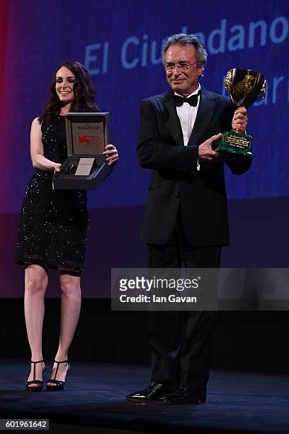 Actor Oscar Martinez is given a Jaeger-LeCoultre Unique Reverso engraved watch as he receives the Coppa Volpi for Best Actor for 'The Distinguished...