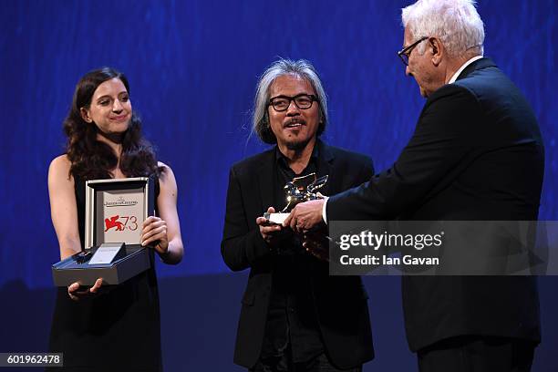 President of the festival Paolo Baratta hands the award as Director Lav Diaz is given a Jaeger-LeCoultre Unique Reverso engraved watch and receives...