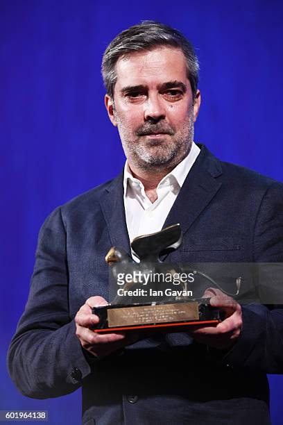Guest poses with the Best Documentary on Cinema Award for 'Le Concours' of director Claire Simon during the closing ceremony of the 73rd Venice Film...