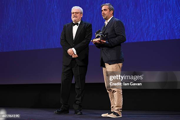 Guest receives the Best Documentary on Cinema Award for 'Le Concours' of director Claire Simon from Roberto Ando during the closing ceremony of the...