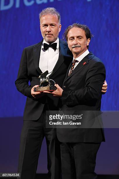 Gian Luca Farinelli poses with the award "Venezia Classici per il Miglior Film Restaurato" on the stage at the closing ceremony of the 73rd Venice...