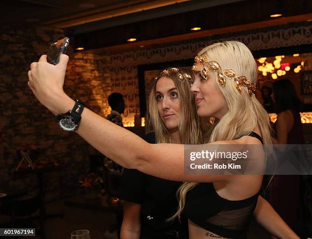 Abigail Breslin and Emily Bach try on jewellery at the New York Fashion Week Brunch with Kali Hawk and Natalie Zfat at Trademark Restaurant on...
