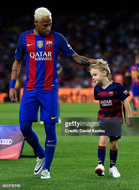Neymar Jr. Of FC Barcelona holds his son Davi Lucca prior to the La Liga match between FC Barcelona and Deportivo Alaves at Camp Nou stadium on...