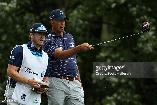 Matt Kuchar and his caddie John Wood speak on the ninth tee during the third round of the BMW Championship at Crooked Stick Golf Club on September...