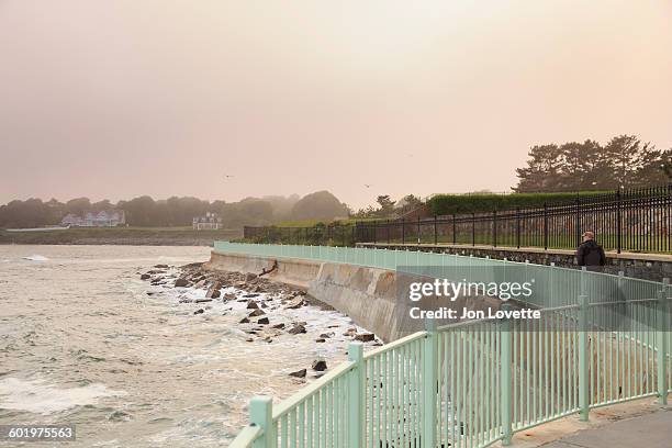 man on newport cliff walk - newport rhode island stock pictures, royalty-free photos & images