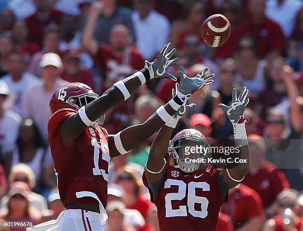 Ronnie Harrison of the Alabama Crimson Tide intercepts a pass by the Western Kentucky Hilltoppers at Bryant-Denny Stadium on September 10, 2016 in...