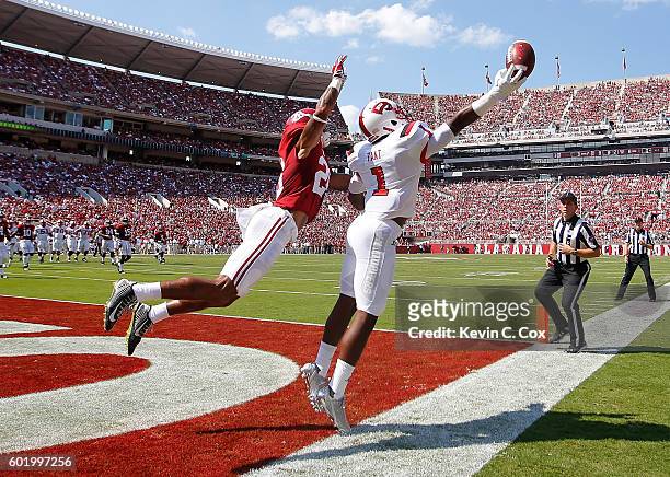 Nacarius Fant of the Western Kentucky Hilltoppers fails to pull in this touchdown reception against Anthony Averett of the Alabama Crimson Tide at...