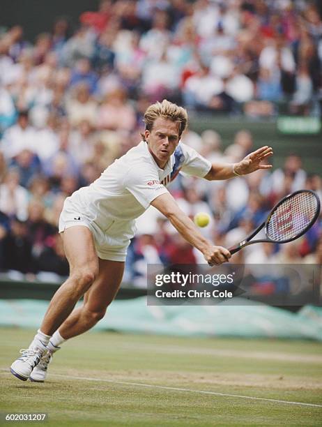 Stefan Edberg of Sweden reaches to make a backhand return shot against Goran Ivanisevic during their Quarter Final match of the Wimbledon Lawn Tennis...